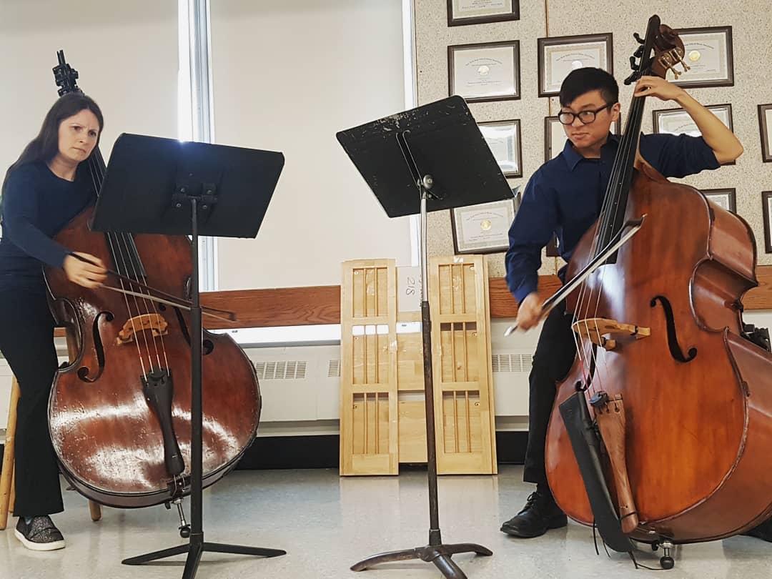 Image of Tommy playing Anderson Duets with Dr. Benson.